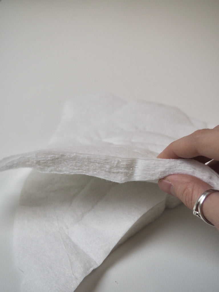 Shaped White Shoulder Pads