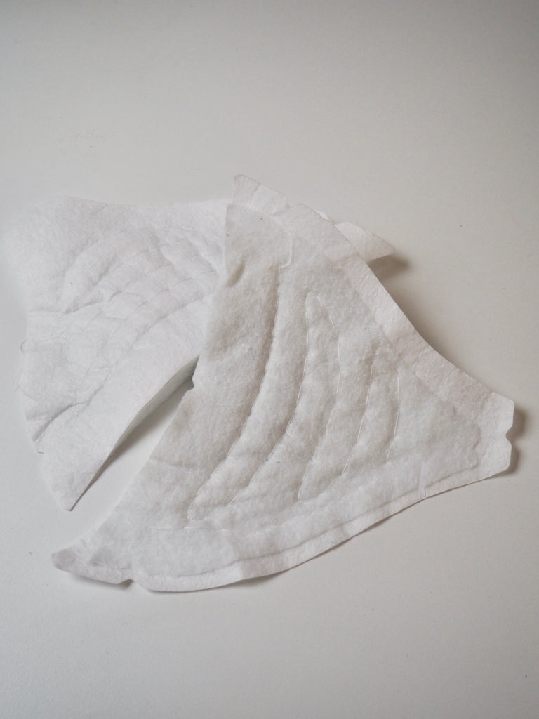 Shaped White Shoulder Pads