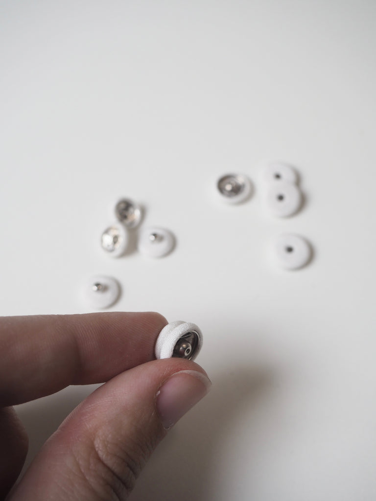 White Fabric Covered Press Studs 12mm