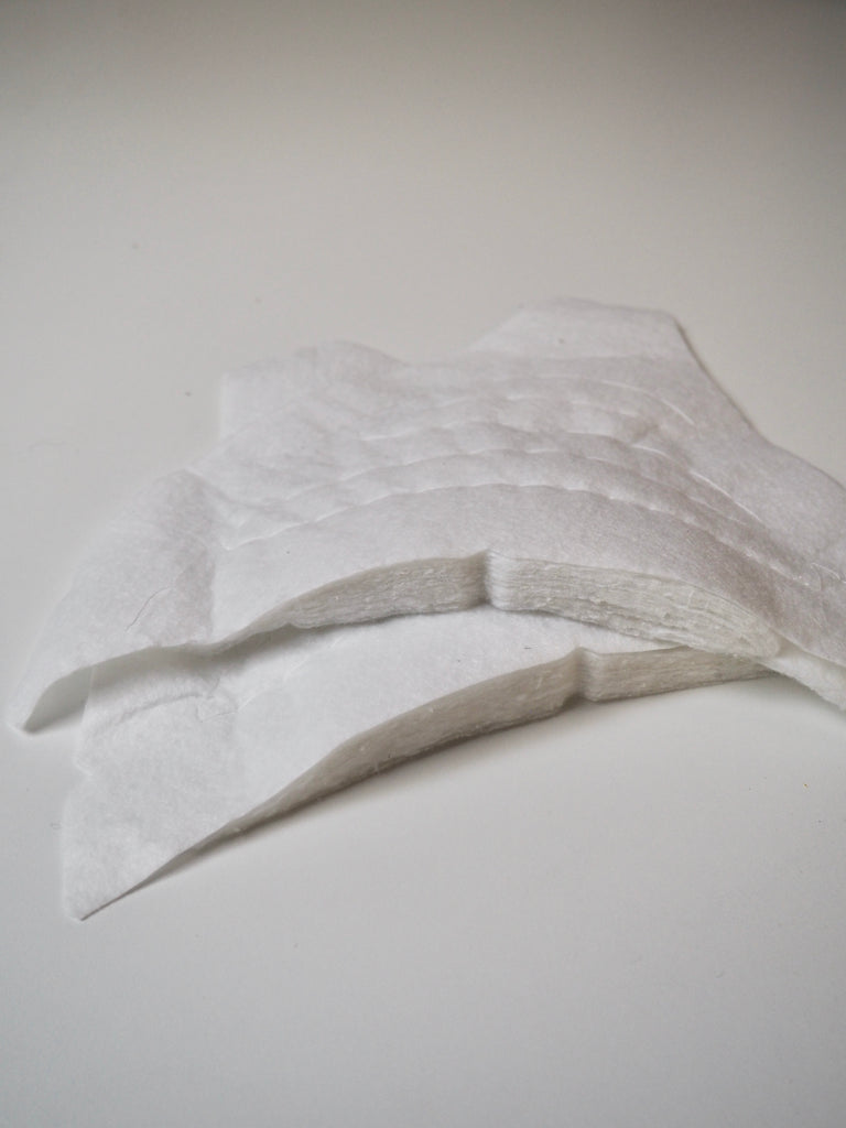 Shaped White Shoulder Pads